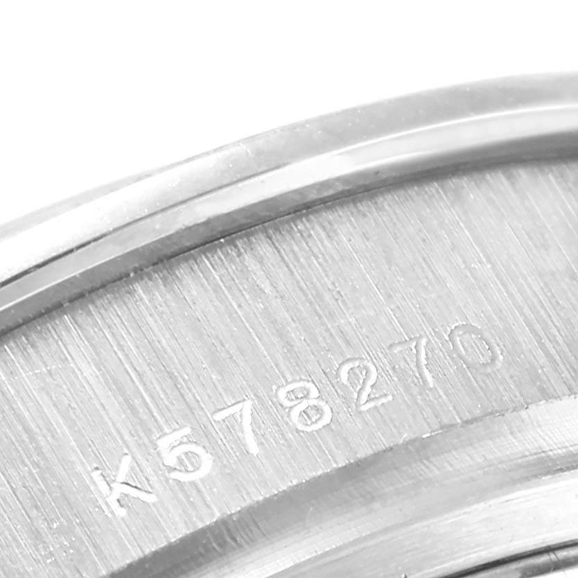 This image shows a close-up of the serial number engraved on the back of a Rolex Pearlmaster 80299 Women
s White Gold Mother of Pearl Dial 80299 Women
s White Gold Mother of Pearl Dial watch.