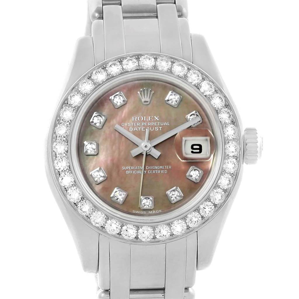 The image shows a frontal view of a Rolex Pearlmaster 80299 Women
s White Gold Mother of Pearl Dial 80299 Women
s White Gold Mother of Pearl Dial watch, highlighting its dial, bezel adorned with diamonds, and part of the bracelet.