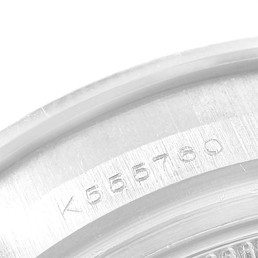 The image shows a close-up of the serial number engraved on the Pearlmaster model by Rolex, focusing on the case back edge.
