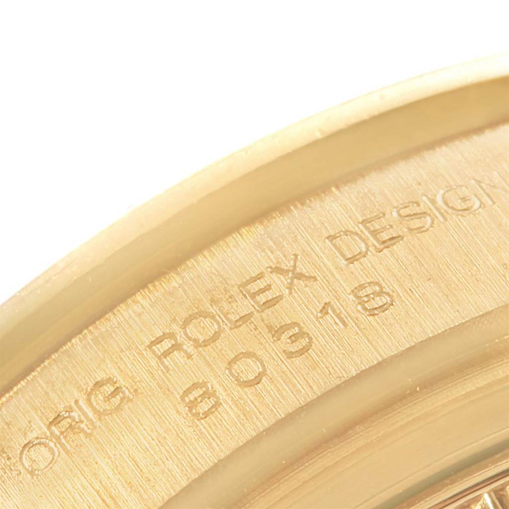 This close-up image shows the engraved inner bezel of the Rolex Pearlmaster 80318 Men's Yellow Gold Mother of Pearl Dial 80318 Men's Yellow Gold Mother of Pearl Dial watch.