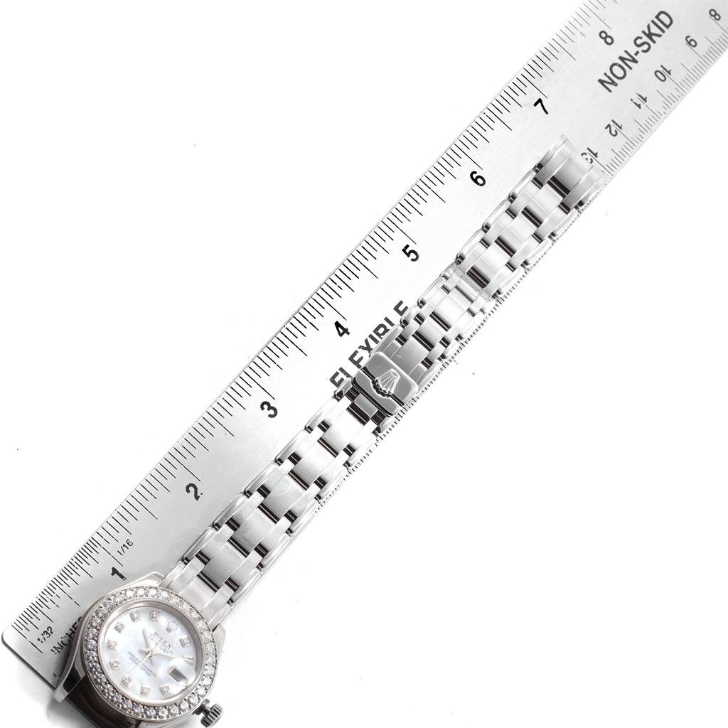 The image shows a Rolex Pearlmaster 80299 Women's White Gold Mother of Pearl Dial 80299 Women's White Gold Mother of Pearl Dial watch from an overhead angle, displaying the face, bracelet, and clasp next to a ruler.