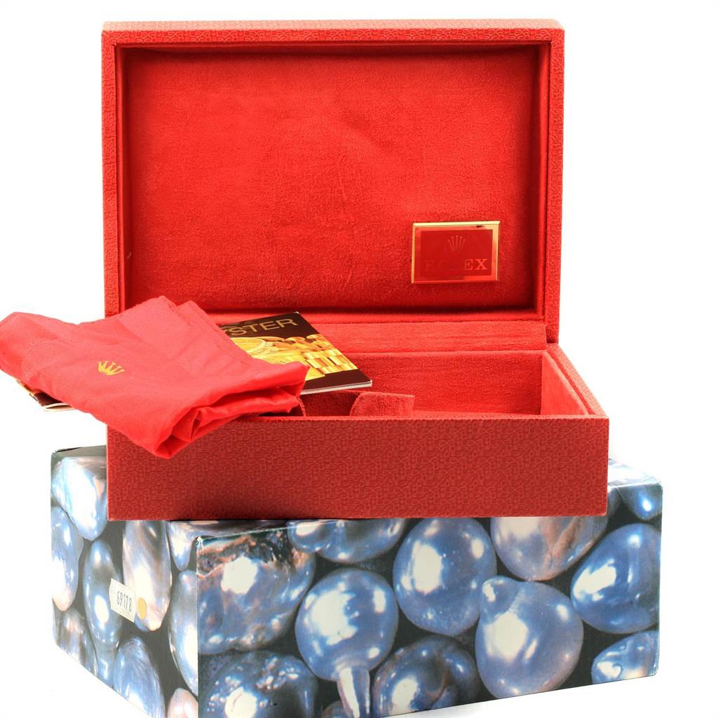 The image shows the packaging and accessories for a Rolex Pearlmaster 80299 Women's White Gold White Dial 80299 Women's White Gold White Dial watch, including the box, cloth, and booklet.