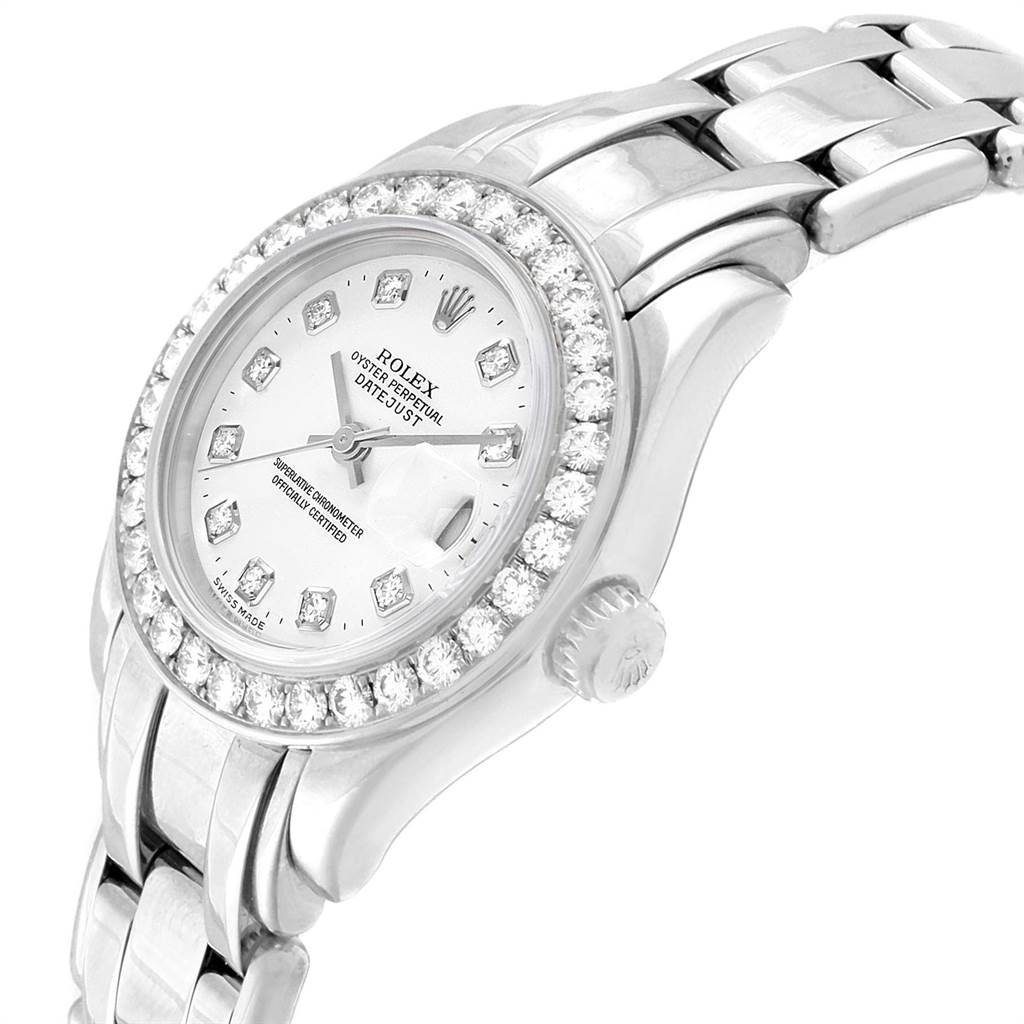 The image shows a side-angle view of a Rolex Pearlmaster 80299 Women's White Gold White Dial 80299 Women's White Gold White Dial watch highlighting its diamond bezel, silver dial, and bracelet.