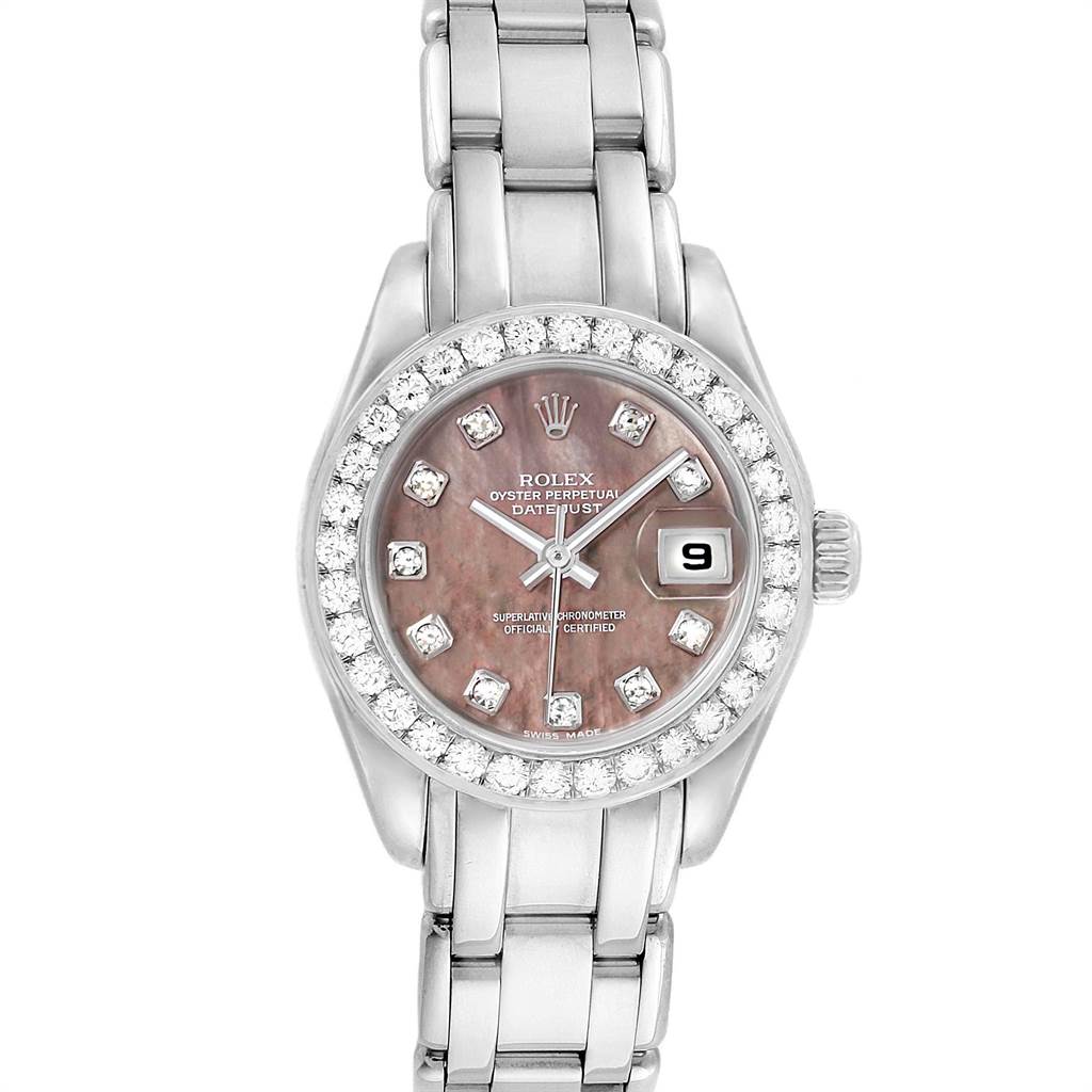 This image shows a Rolex Pearlmaster 80299 Women
s White Gold Mother of Pearl Dial 80299 Women
s White Gold Mother of Pearl Dial watch from a top-down angle, featuring its face, bracelet, and bezel.