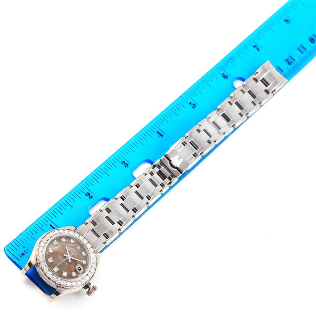 The image shows a Rolex Pearlmaster 80299 Women's White Gold Mother of Pearl Dial 80299 Women's White Gold Mother of Pearl Dial watch face and bracelet, laid next to a blue ruler for measurement.