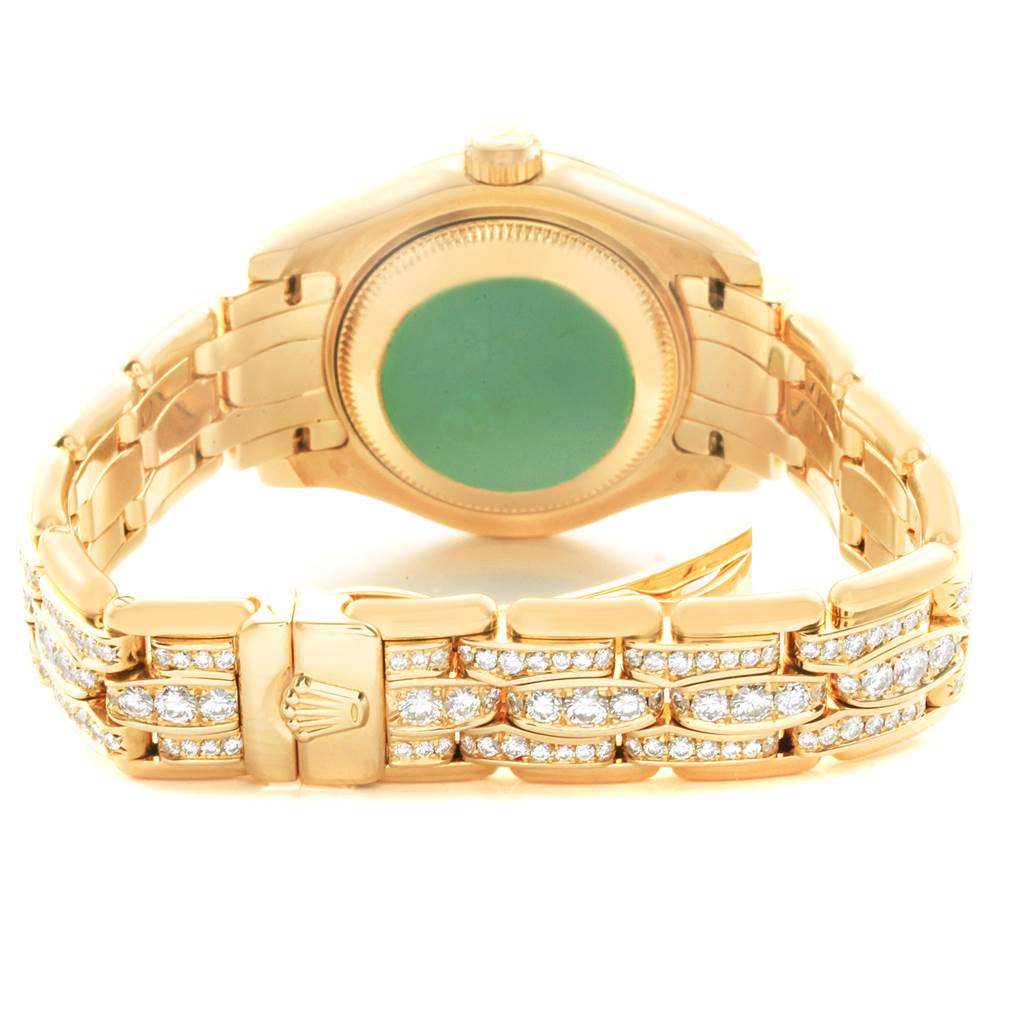 The image shows the back view of the Rolex Pearlmaster 69298 Women's Yellow Gold Mother of Pearl Dial 69298 Women's Yellow Gold Mother of Pearl Dial watch, highlighting its golden bracelet and gem-encrusted links.