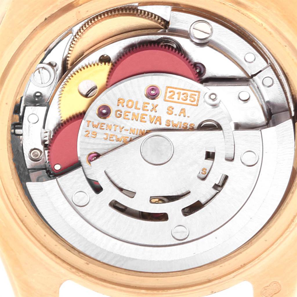The image shows the intricate internal mechanism of a Rolex Pearlmaster 69298 Women's Yellow Gold Mother of Pearl Dial 69298 Women's Yellow Gold Mother of Pearl Dial watch at an angled close-up shot.