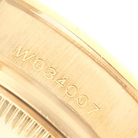 The image shows a close-up angle of the case back with the serial number of a Rolex Pearlmaster 69298 Women's Yellow Gold Mother of Pearl Dial 69298 Women's Yellow Gold Mother of Pearl Dial watch.