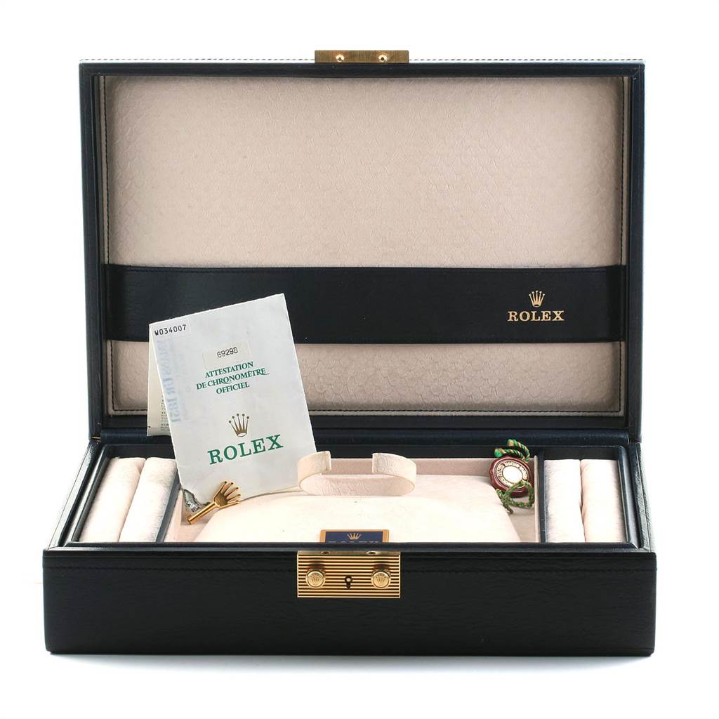 This image shows the open box of a Rolex Pearlmaster 69298 Women's Yellow Gold Mother of Pearl Dial 69298 Women's Yellow Gold Mother of Pearl Dial watch, including documents and watch accessories displayed neatly inside.