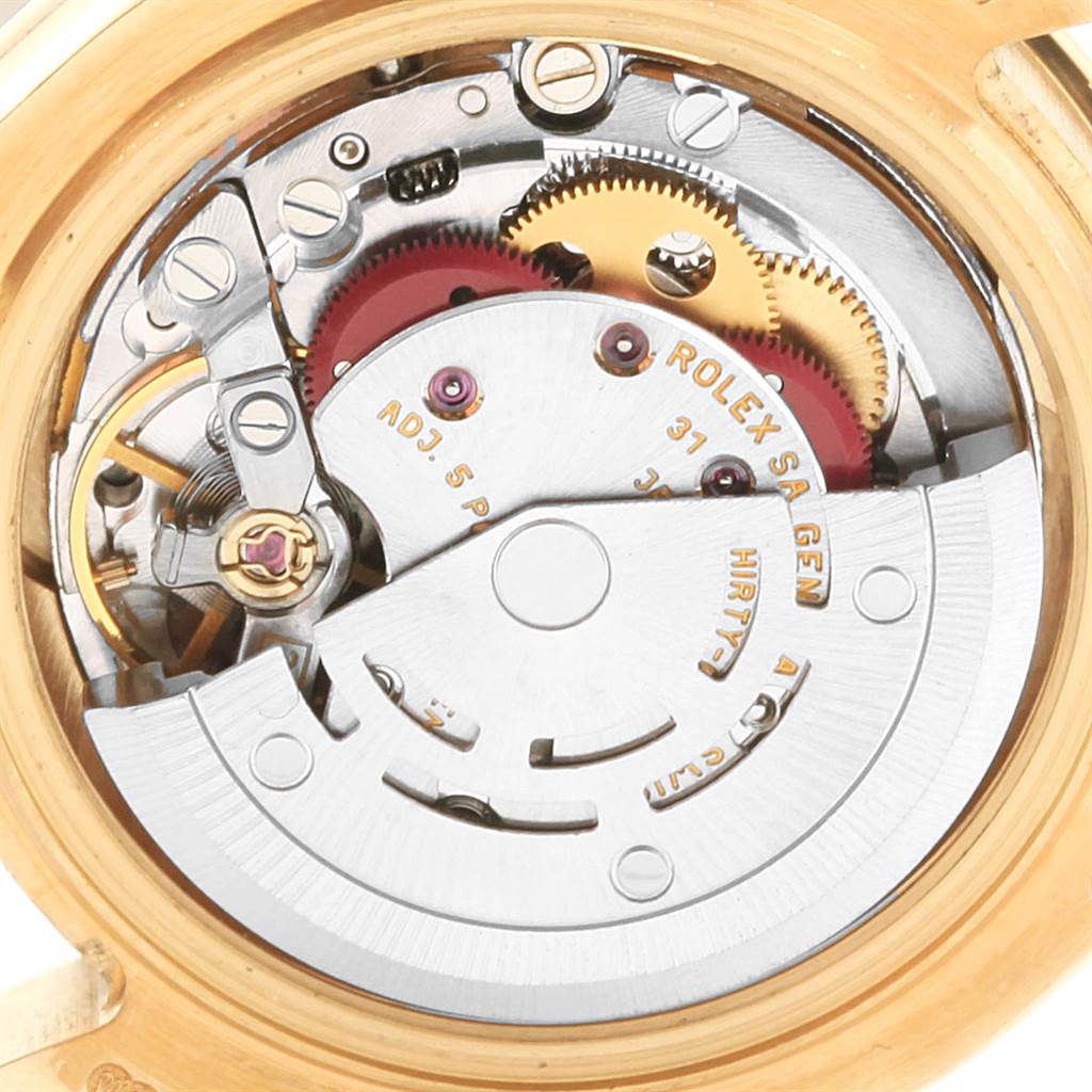 This image shows the inner mechanism and movement components of a Rolex Pearlmaster 80308 Women's Yellow Gold Mother of Pearl Dial 80308 Women's Yellow Gold Mother of Pearl Dial watch from a top-down angle.