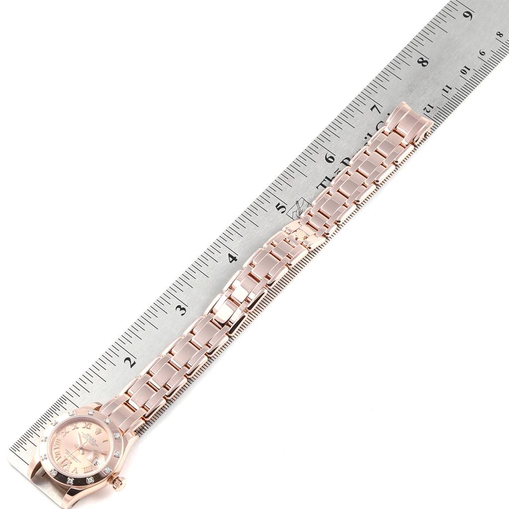 The image shows a Rose Gold Rolex Pearlmaster 80315 Women's Rose Gold Champagne Dial 80315 Women's Rose Gold Champagne Dial watch laid flat next to a ruler, displaying the entire watch face and bracelet.