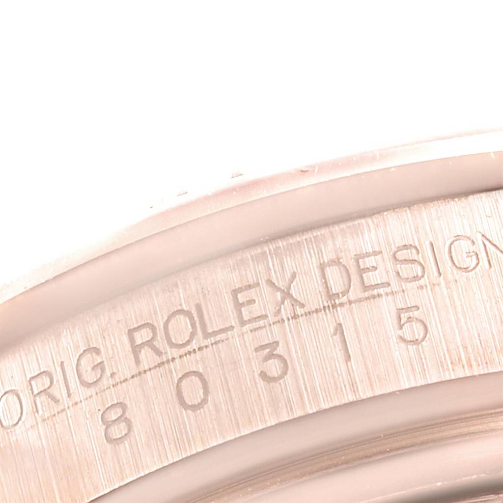 Close-up of the Rolex Pearlmaster 80315 Women's Rose Gold Champagne Dial 80315 Women's Rose Gold Champagne Dial watch case back, showing the engraved serial number and "Rolex Design".