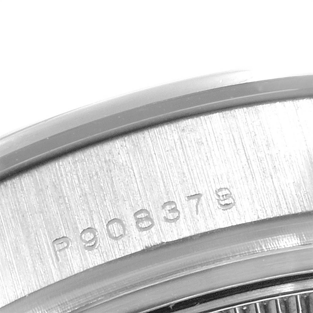 This image shows a close-up of the serial number engraving on the metal casing of the Rolex Pearlmaster 80299 Women's White Gold Mother of Pearl Dial 80299 Women's White Gold Mother of Pearl Dial watch.