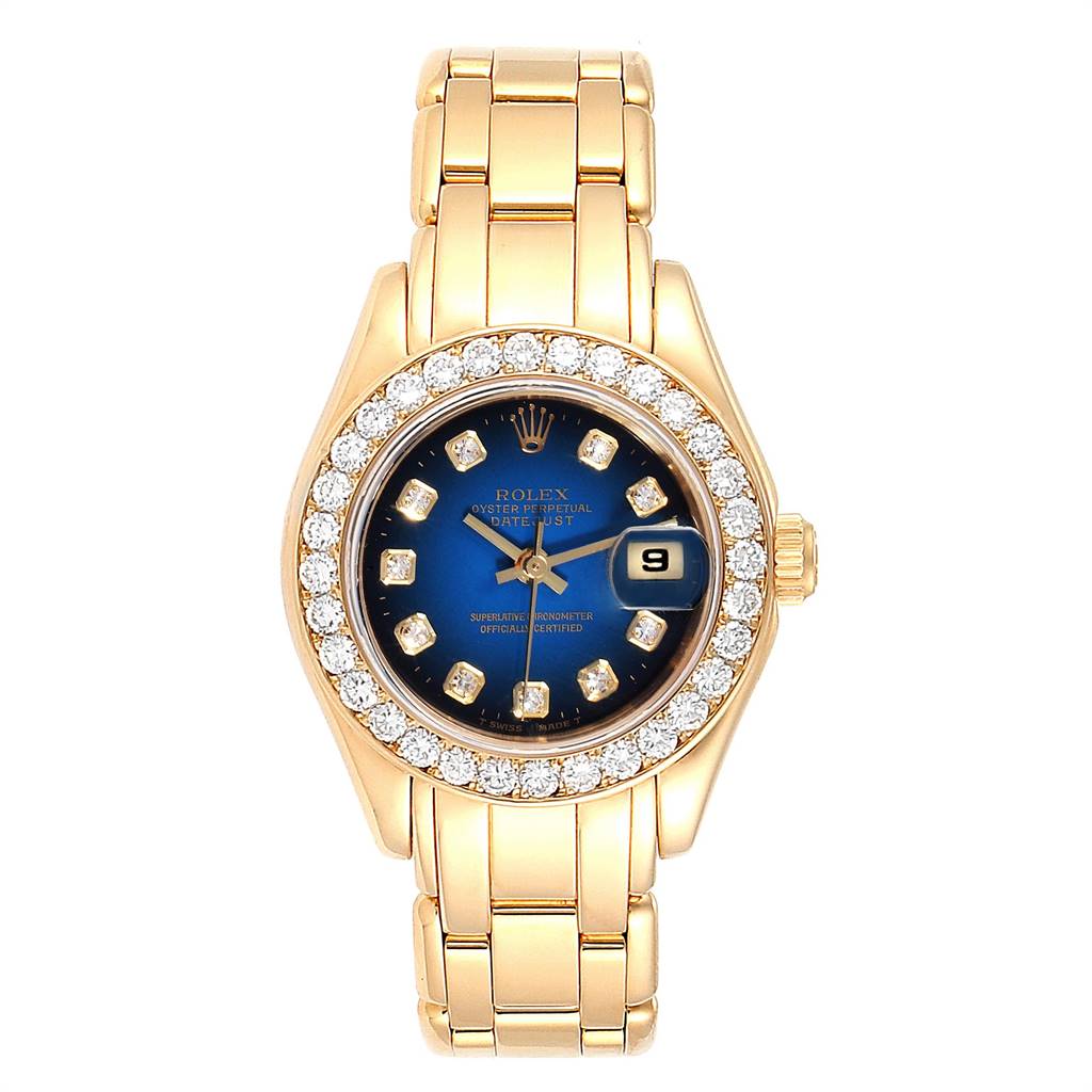 The image shows a front view of a Rolex Pearlmaster 69298 Women's Yellow Gold Blue Dial 69298 Women's Yellow Gold Blue Dial watch, highlighting its gold bracelet, blue dial, and diamond-studded bezel.