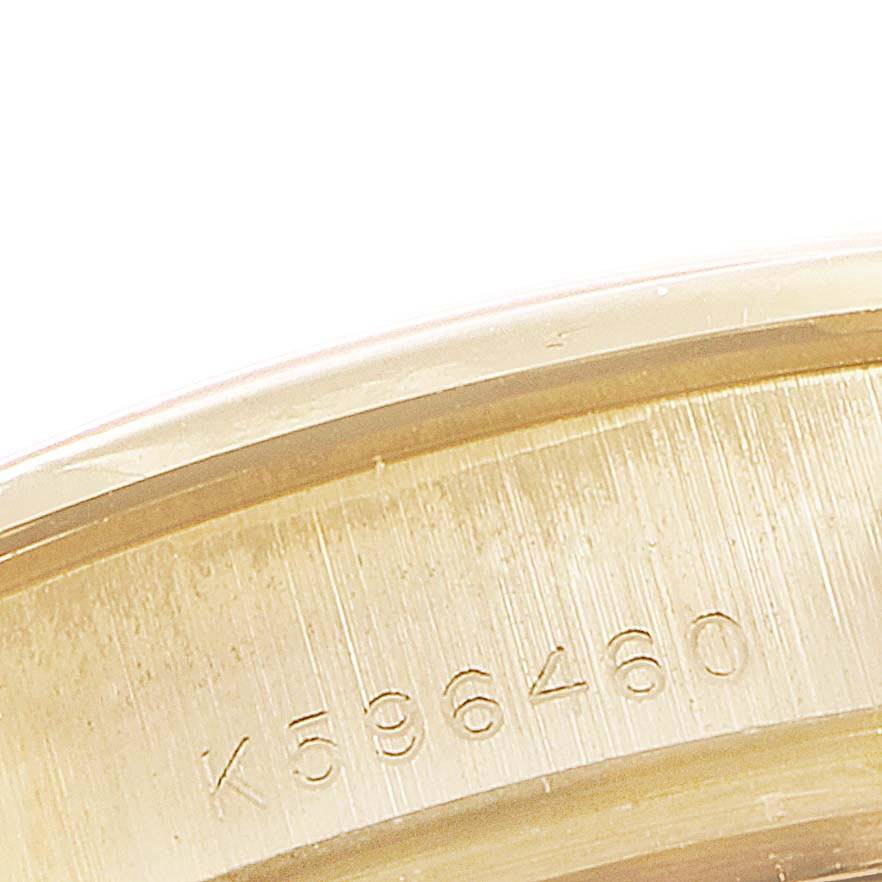 This image shows an engraved serial number on the gold case back of the Rolex Pearlmaster 80298 Women's Yellow Gold Mother of Pearl Dial 80298 Women's Yellow Gold Mother of Pearl Dial watch.