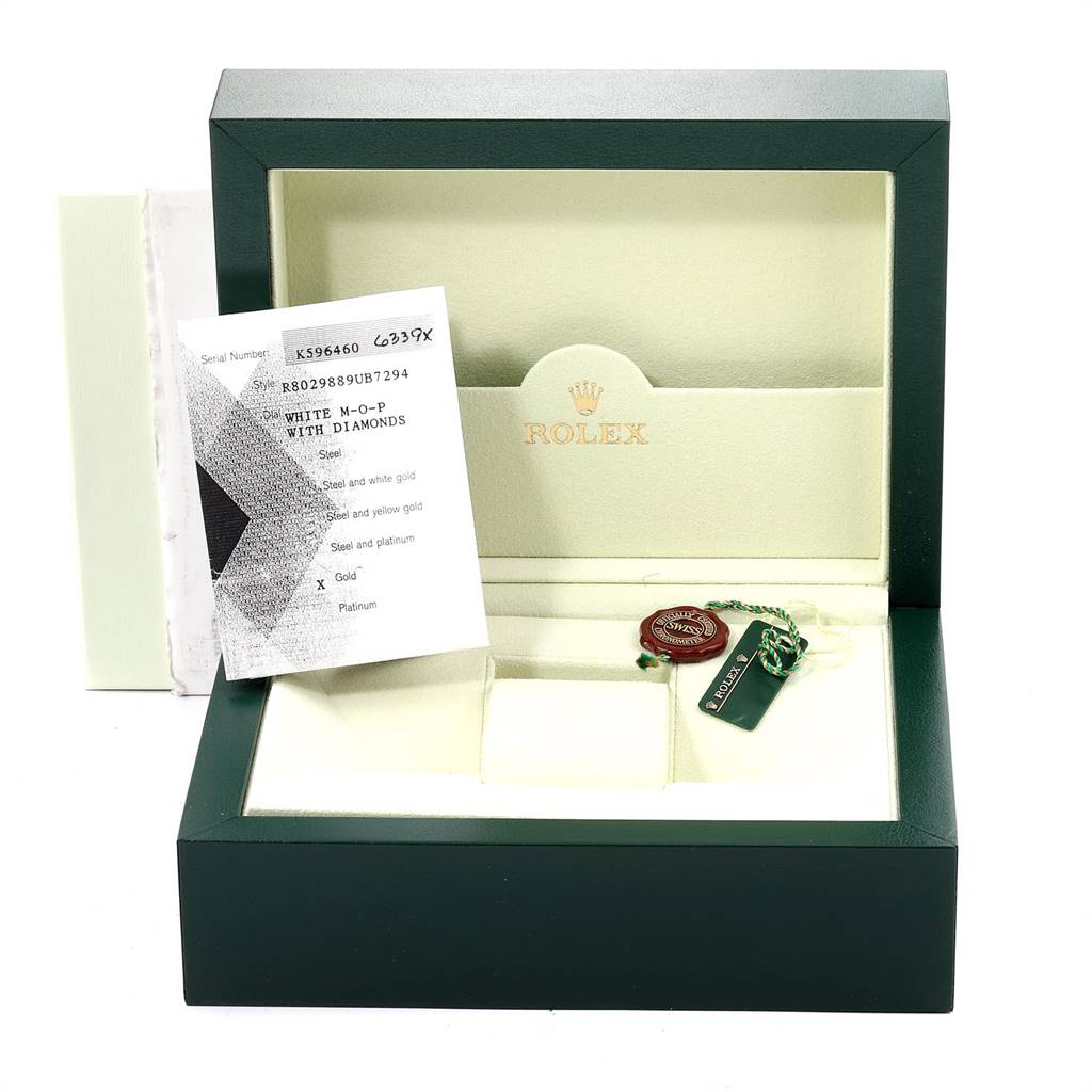 The image shows a Rolex Pearlmaster 80298 Women's Yellow Gold Mother of Pearl Dial 80298 Women's Yellow Gold Mother of Pearl Dial watch box, an authentication booklet, a tag, and accessory items, from a frontal angle.