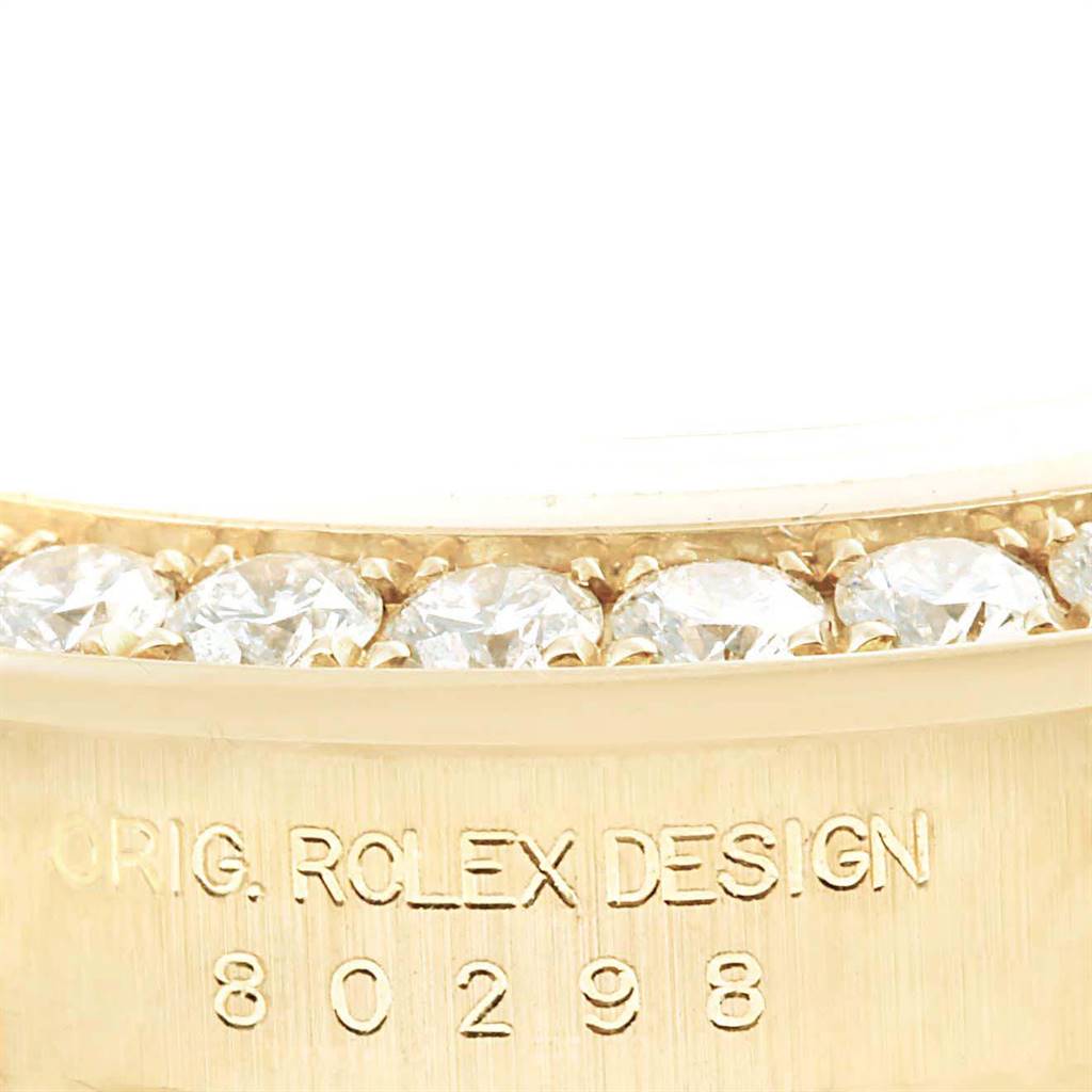 The image shows a close-up of the diamond-encrusted bezel and model number engraving of a Rolex Pearlmaster 80298 Women's Yellow Gold Mother of Pearl Dial 80298 Women's Yellow Gold Mother of Pearl Dial watch.