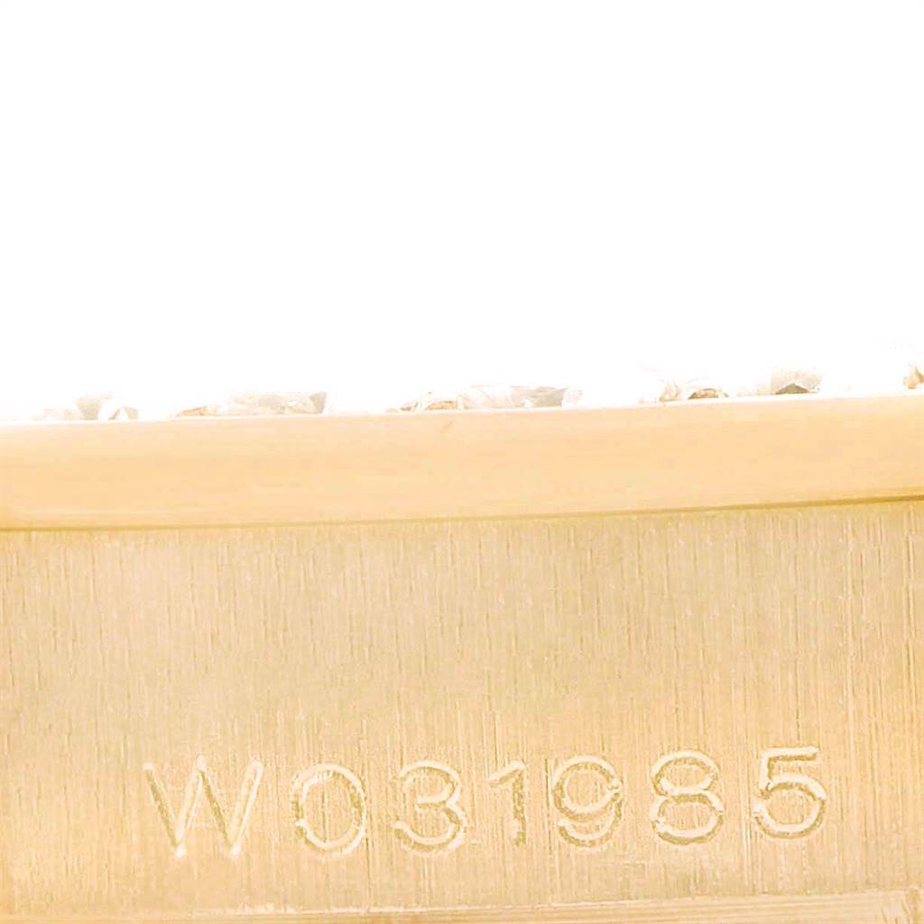 This close-up image shows the engraved serial number on the side of the Rolex Pearlmaster 69298 Women's Yellow Gold Champagne Dial 69298 Women's Yellow Gold Champagne Dial watch case.