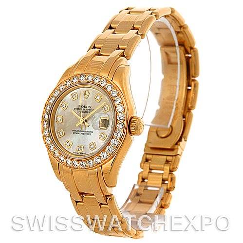 The image shows a Rolex Pearlmaster 802998 Women's Yellow Gold Mother of Pearl Dial 802998 Women's Yellow Gold Mother of Pearl Dial watch from a front-side angle, highlighting its gold bracelet, diamond bezel, and detailed dial.