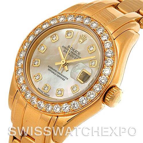 The image shows a close-up view of the Rolex Pearlmaster 802998 Women's Yellow Gold Mother of Pearl Dial 802998 Women's Yellow Gold Mother of Pearl Dial watch, highlighting the diamond-encrusted bezel, dial, and part of the bracelet.