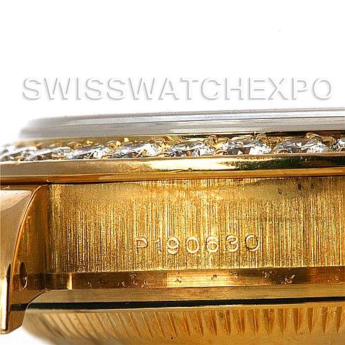This image shows a close-up of the side of the Rolex Pearlmaster 802998 Women's Yellow Gold Mother of Pearl Dial 802998 Women's Yellow Gold Mother of Pearl Dial watch case, highlighting the engraved serial number and part of the diamond-set bezel.