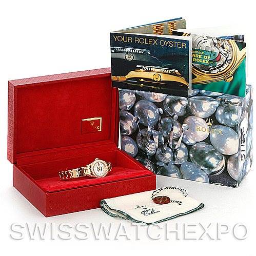 The image shows a Rolex Pearlmaster 80298 Women's Yellow Gold Mother of Pearl Dial 80298 Women's Yellow Gold Mother of Pearl Dial watch in its red box, accompanied by booklets, a green box, and a protective cloth.