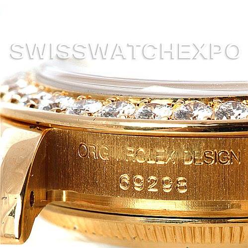 This close-up image of a Rolex Pearlmaster 69298 Women's Yellow Gold Mother of Pearl Dial 69298 Women's Yellow Gold Mother of Pearl Dial watch shows the bezel with diamonds and part of the case with the model number 69298.