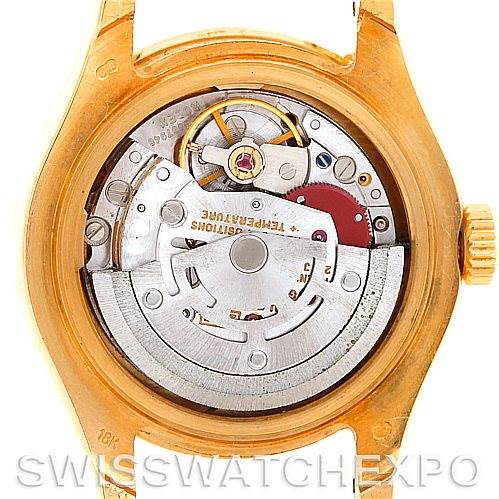 The image shows the back view of the Rolex Pearlmaster 69298 Women's Yellow Gold Mother of Pearl Dial 69298 Women's Yellow Gold Mother of Pearl Dial watch, displaying its internal mechanical movement.