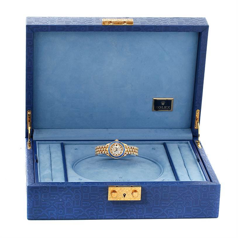 The image shows a Rolex Pearlmaster 69308 Women's Yellow Gold  69308 Women's Yellow Gold  watch presented inside an open blue Rolex box.